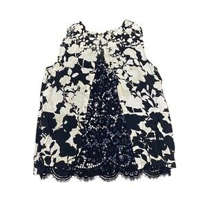 Sleeveless Blouse with a bold black and white floral design